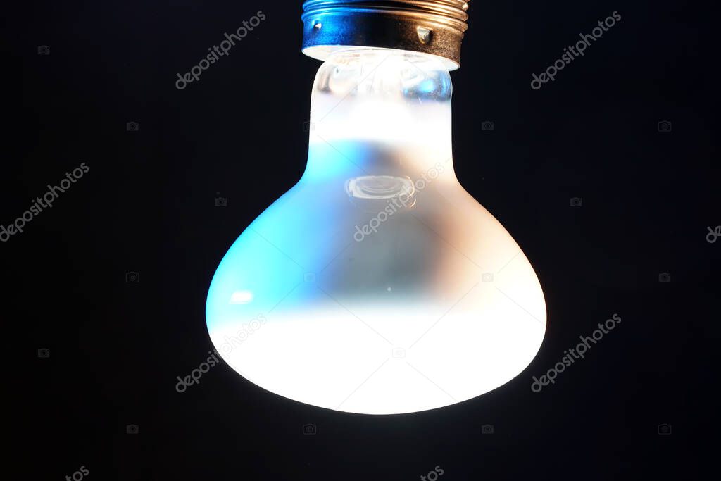 Old lightbulbs in the studio on black background photographed with flash light