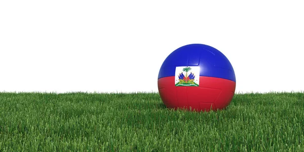 Haiti bola de futebol bandeira haitiana deitado na grama — Fotografia de Stock