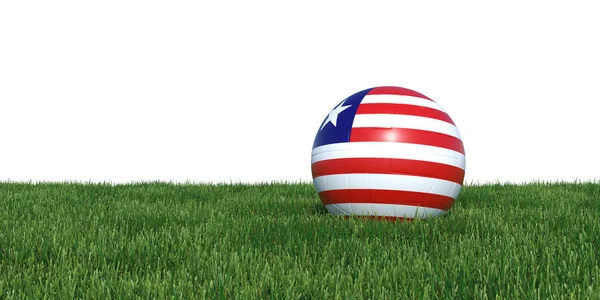 Liberia pelota de fútbol bandera liberiana acostado en la hierba — Foto de Stock