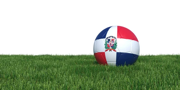 Dominikánská republika vlajka fotbalový míč ležící v trávě — Stock fotografie