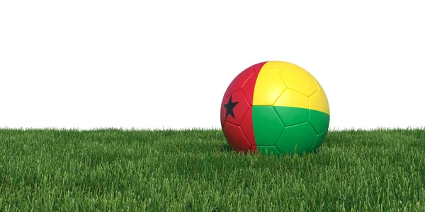 Guinea-Bissau vlajky fotbalový míč ležící v trávě — Stock fotografie