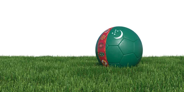 Turkmenistan flagga fotboll bollen liggande i gräset — Stockfoto