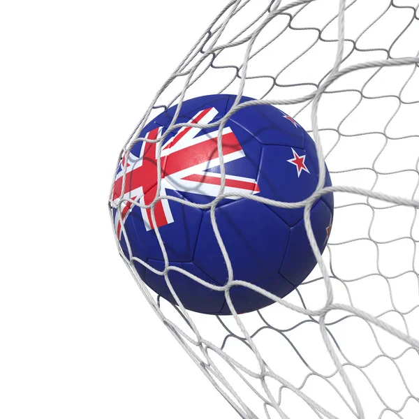 Футбольный мяч под новозеландским флагом внутри сетки — стоковое фото