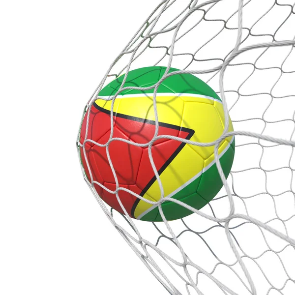 Guayana guayanský vlajka fotbalový míč uvnitř sítě, v síti. — Stock fotografie