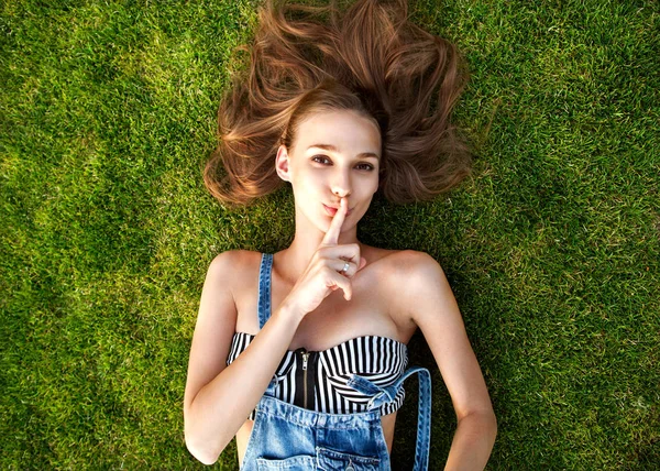 Relaxing after long trip. Top view of beautiful young woman — Stock Photo, Image
