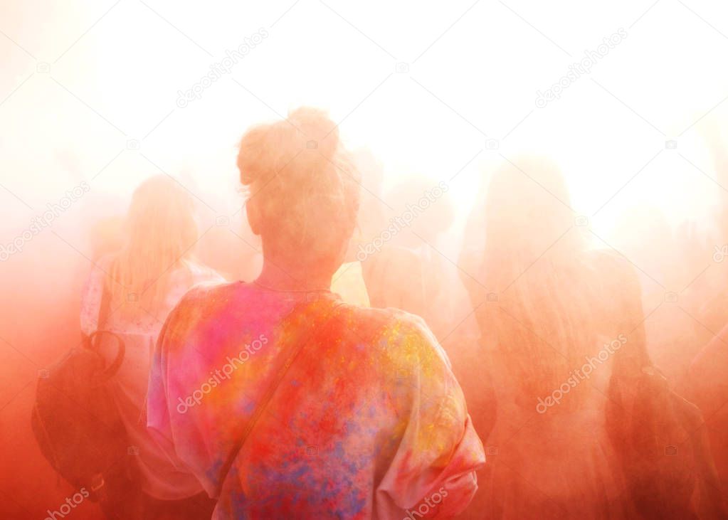 a crowd of people celebrating the Holi festival 