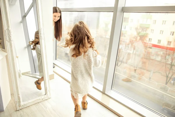 Mother Daughter Have Fun Standing Huge Window Daughter Gives Her — Stock Photo, Image