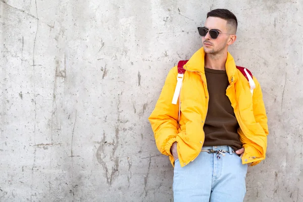 fashion guy with a backpack of products, shopping online, takeaway food