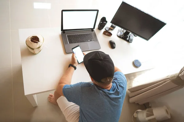 Young man having Zoom video conferencing call via computer. Home office. Stay at home and work from home concept during Coronavirus pandemic