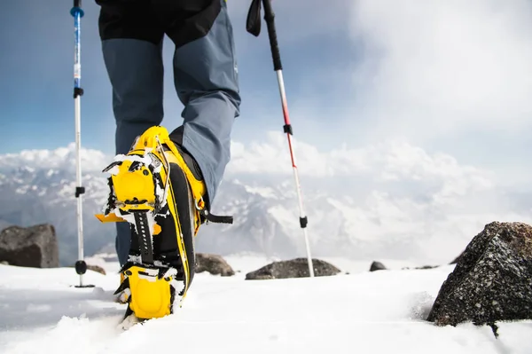 Man walking with crampons — стоковое фото