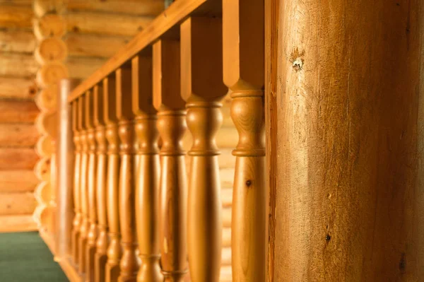 Close-up row of wooden column wooden stairs in wooden blockhouse house — Stock Photo, Image