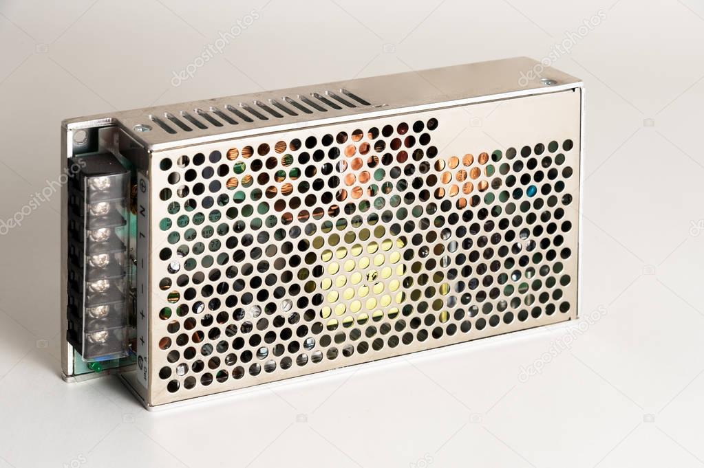 New unit - power supply for converters and industrial equipment on a gray background