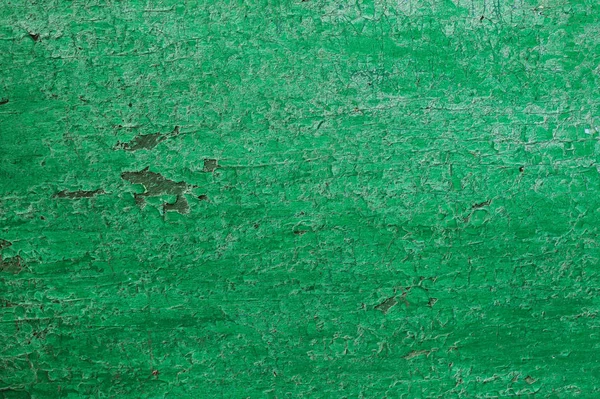 Textura dřevěné desky v zelené. Rozpraskané zelené barvy na povrchu trávníku — Stock fotografie