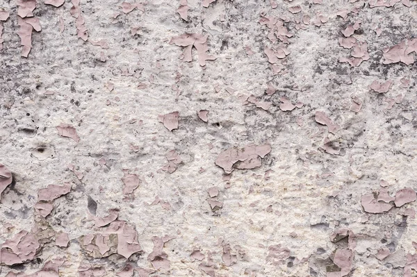 Elementos Recubrimiento de pintura rosa con grietas en una piedra gris sucia. Pelar pintura rosa Grunge — Foto de Stock