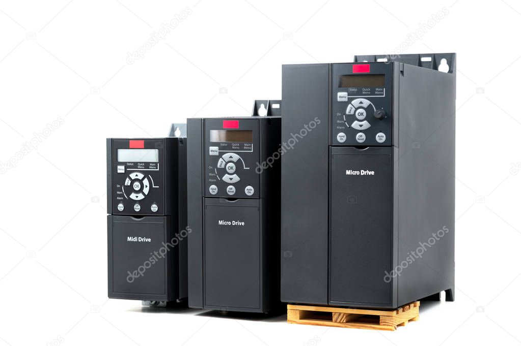 A group of three different sizes and capacities new universal inverter for controlling the electric current and power for industrial on a isolated white background. A frequency converter - rectifier -