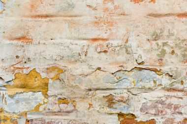 Yakın çekim dokulu arka plan çok katmanlı dökülüyor boya duvar. Boya yüzeyi cleaved katmanlar halinde farklı renkleri karıştırma. Doku derin bir desen ile