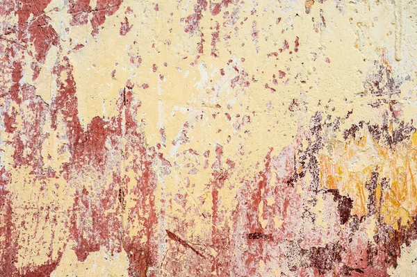 Strukturierter Hintergrund aus mehrschichtiger abblätternder Farbe an der Wand. Mischen verschiedener Farben in den gespaltenen Schichten auf der Oberfläche. Grunge-Textur mit tiefem Muster — Stockfoto