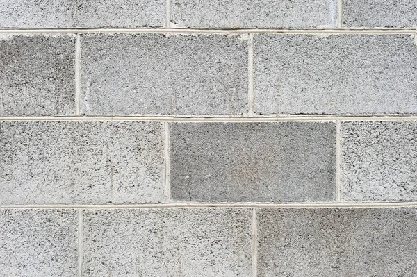 The texture of the wall is the laying of expanded clay blocks. Background for the advertisement of building materials. Close-up Gray concrete foam block. — Stock Image The texture of the wall is the laying of expanded clay blocks. Background for the advertisement of building materials. Close-up Gray concrete foam block. Stock Picture