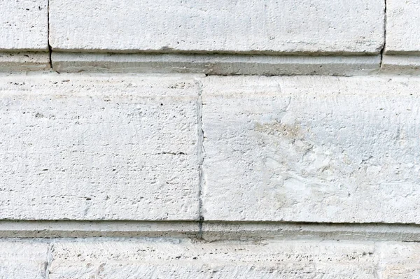 Old stone cladding plates on the wall closeup