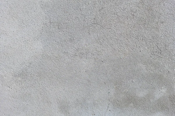 회색 시멘트 벽에 좋은 콘크리트 칩을 붙이고. 건축 배경 — 스톡 사진