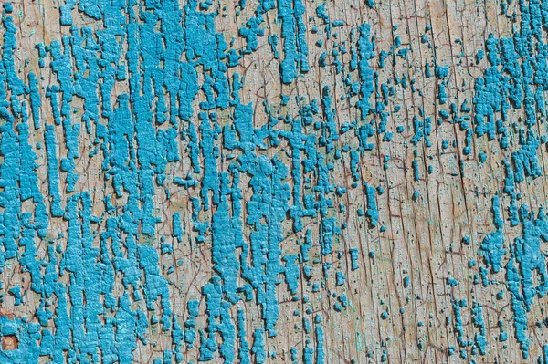 Old and peeling paint Over time, the blue paint peeled off from the old boards and the wood texture cracked. Vintage Abstract Grunge Background — Stock Photo, Image