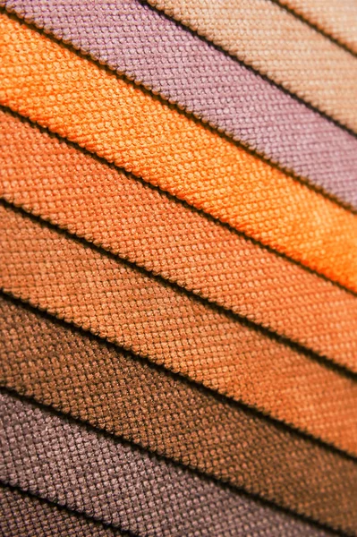 Colorful and bright fabric samples of furniture and clothing upholstery. Close-up of a palette of textile abstract stripes of different colors — Stock Photo, Image