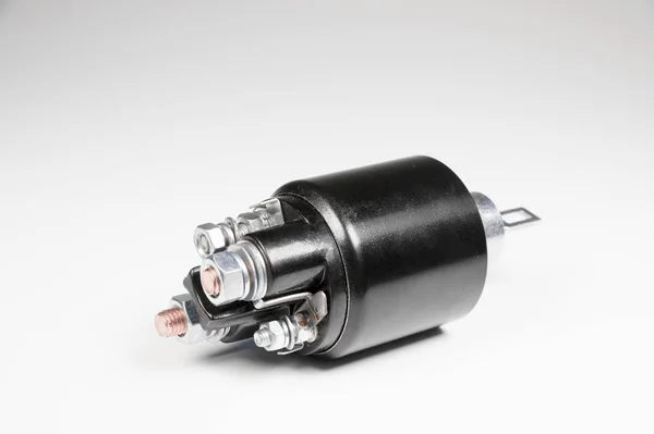 New black solenoid for a starter for a car on a gray gradient background. Auto parts. Starter Parts — Stock Photo, Image
