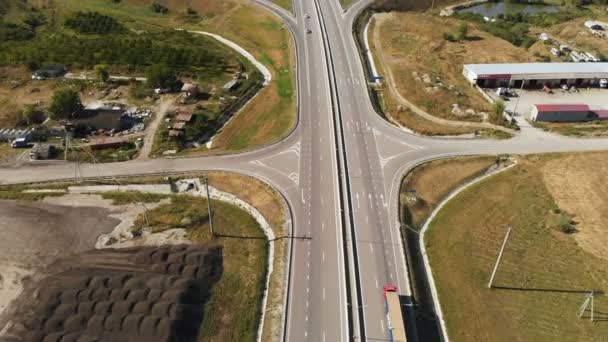 Aerial view. On freeway, road junction, cars are driving fast. Summer, day. — 비디오