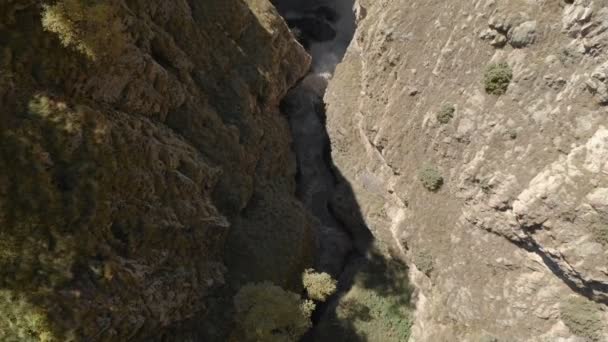 Aerial view of a huge waterfall from a sheer cliff in the Caucasus. Close shot of a large stream of water in the mountains. Caucasian Iceland — ストック動画