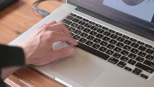 Male hand is typing on laptop, presses space bar. Man works in program. Closeup — Stock Video