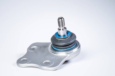 New spare parts spherical ball joints of a suspension bracket of a car on a gray background clipart