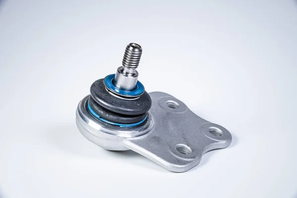 New spare parts spherical ball joints of a suspension bracket of a car on a gray background — 스톡 사진