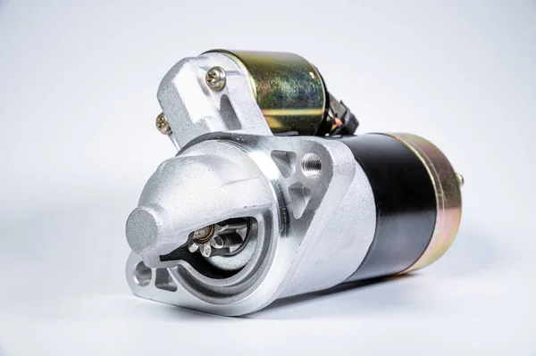 Starter of an internal combustion engine New Spare part for car on a gray background — 스톡 사진