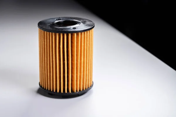 Replaceable cartridge fuel system. New fuel filter element on a gray gradient background — Stock Photo, Image