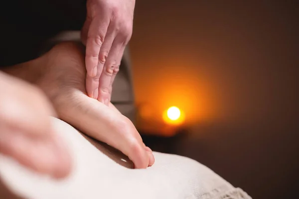 Close-up reflexology foot massage. Male masseur makes foot massage to a female client. Foot Care Concept — Stock Photo, Image