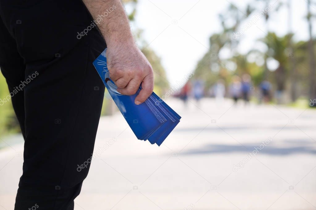 Man Waiting to Give Out Gospel Tracts