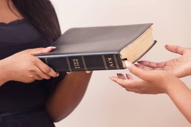 Girl Giving A Bible And Spreading The Good News  clipart