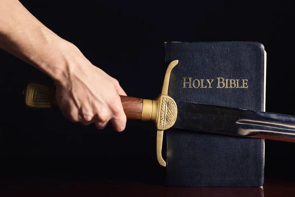 Young Athletic Man with His Bible and Sword — Stok fotoğraf