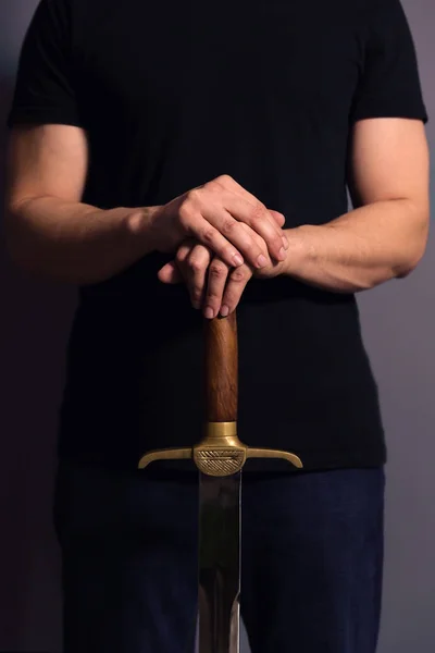 Young Athletic Man Holding His Sword — Stock Photo, Image