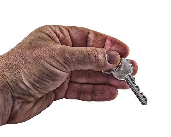 Man's hand holding a metal key from home, closeup — Stock Photo, Image