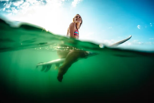 Splitted Shot Underwater View Happy Woman Sitting Surfboard Ocean — Stock Photo, Image