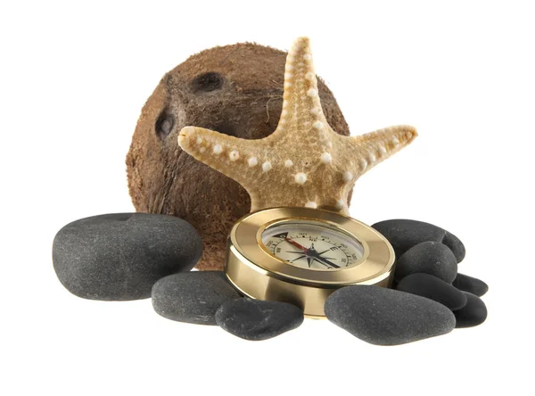 Starfish, coconut, stones, and compass — Stock Photo, Image