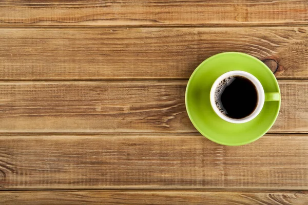 Groene cup met koffie — Stockfoto