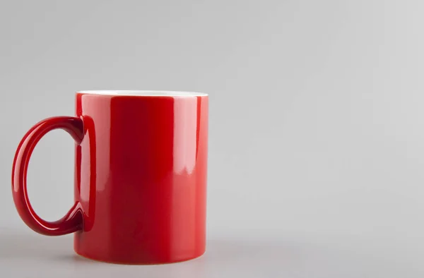 Red cup on a grey background — Stock Photo, Image