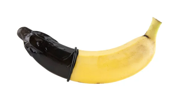 Condón negro y un plátano —  Fotos de Stock