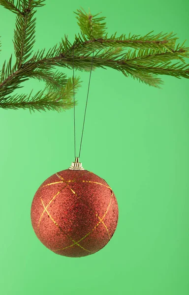 Christmas balls on a green background — Stock Photo, Image