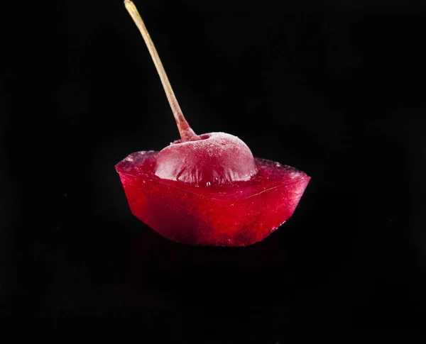 red cherry is in ice