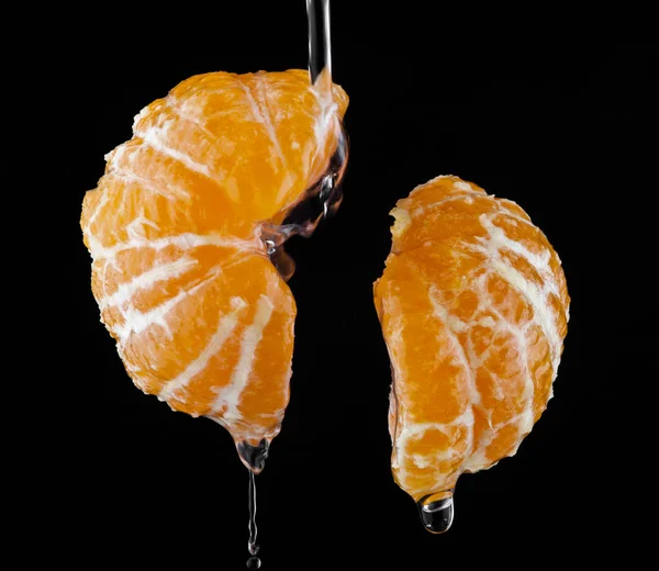 Pomarańcze w kropli wody — Zdjęcie stockowe