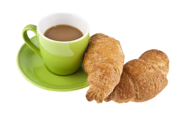 Grön kaffekopp och croissant — Stockfoto