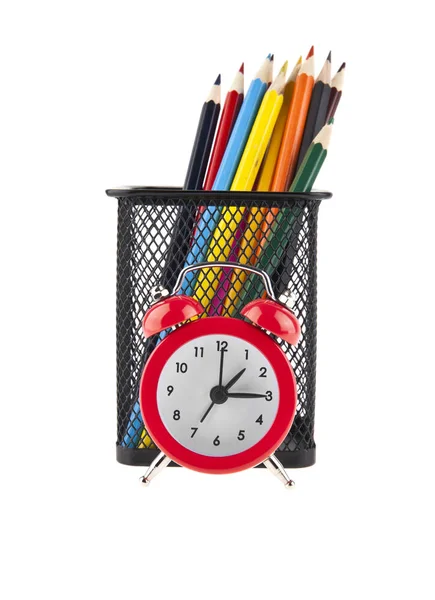 Reloj rojo y lápices — Foto de Stock